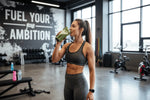 a female body builder taking smoothie